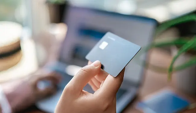 person holding a credit card
